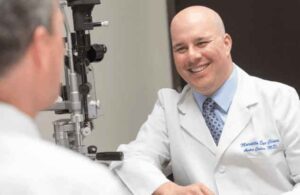 Dr. Andre Cohen, Ophthalmologist at Marietta Eye Clinic with patient